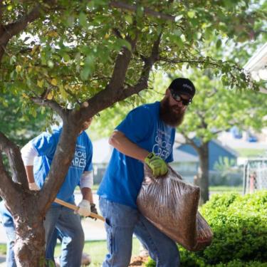 Outside the new Community Services League location, Comcast Cares Day volunteers laid mulch, pruned trees and did some landscaping and general cleanup. 