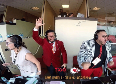 Three people announcing Chiefs football game