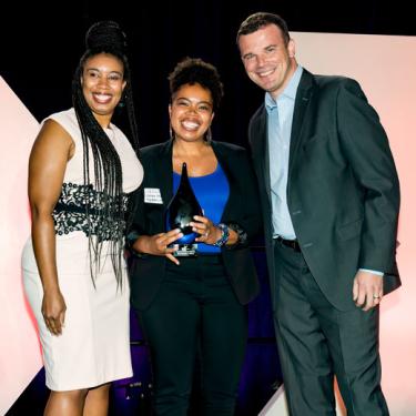 Photo of La'Nesha Frazier and La'Nae Robinson, owners of Bliss Books & Wine receiving the Emerging Business award