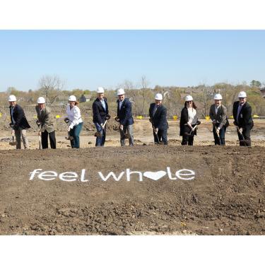 Photo of AdventHealth team performing ceremonial groundbreaking with shovels.