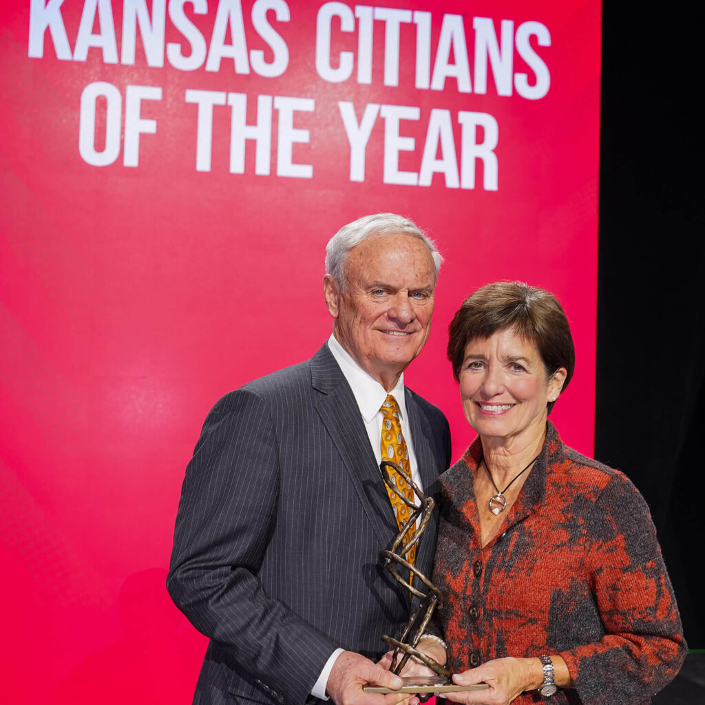 Photo of Peggy and Terry Dunn holding the Kansas Citian of the Year award.